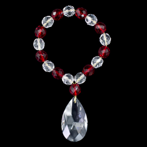 Anello portatovagliolo con perle in cristallo strass trasparente e rosso Ø10 mm con ciondolo mandorla 38 mm.