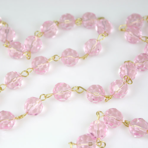 Chain 100 cm Ø 10 mm faceted pink crystal beads, bright brass-plated eyelet pin.