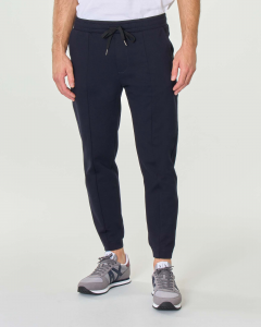Pantalone blu in jersey stretch con taschine a filo con zip sul retro