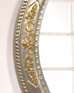 Oval mirror in gold and silver leaf