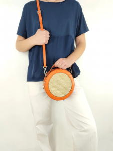 Orange leather and natural straw bag