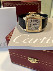 Orologio secondo polso Cartier Santos 100XL in oro giallo 