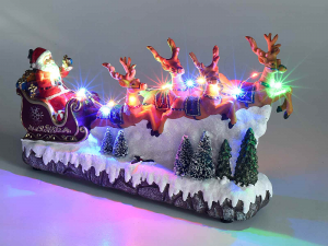 Babbo Natale su slitta in resina con luci multicolore e musica