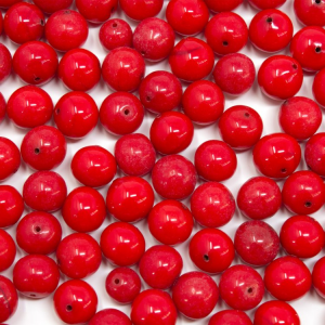 Perla di Murano tonda Ø10 mm vetro rosso in pasta con foro passante.