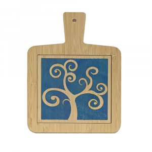 Hand-decorated bamboo cutting board with tree of life motif on a blue background, made in Italy