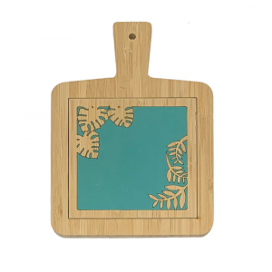 Hand-decorated bamboo cutting board with leaf motif on a turquoise background, made in Italy